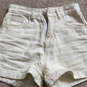 tan shorts, size small, with usable pockets.